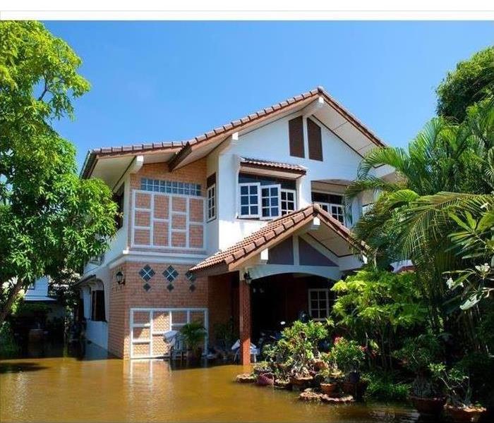 Outdoors of a home surrounded with floodwaters